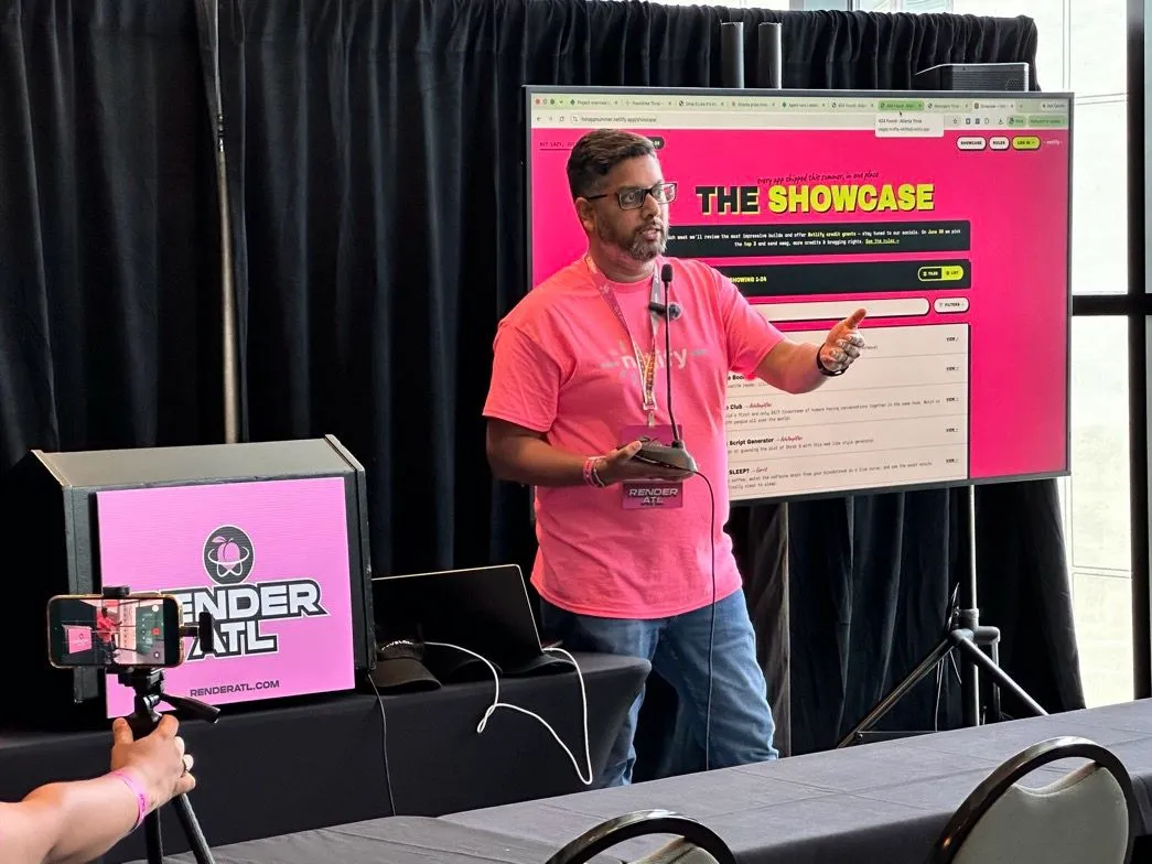 Karthik Puvvada presenting on stage at RenderATL